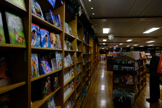 A bookstore aisle filled with books on shelves.
